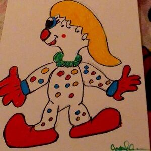 Vibrant Red and Yellow Clown Toy with Polka Dots